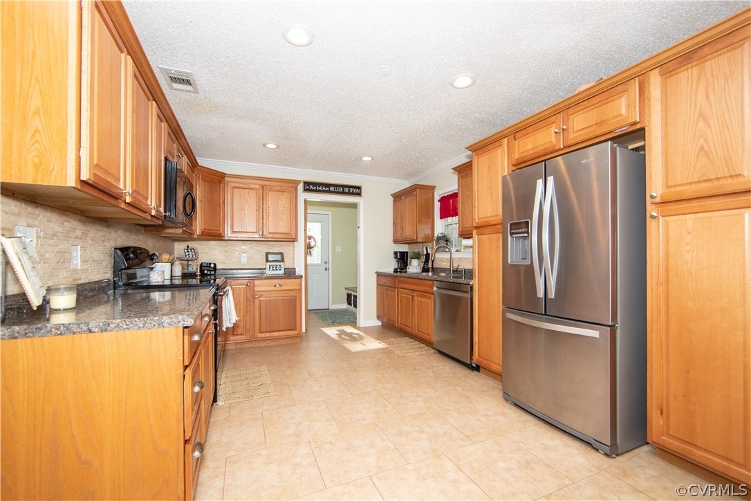 13212 Continental Road Wilsons, VA 23894 - Photo 4 of 26 Update Cabinetry, Stainless Steel Appliances, Tile