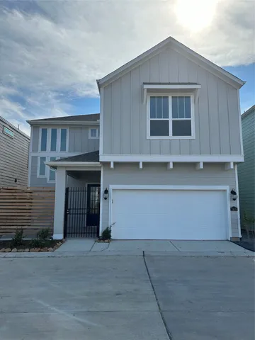 a front view of a house with a garage