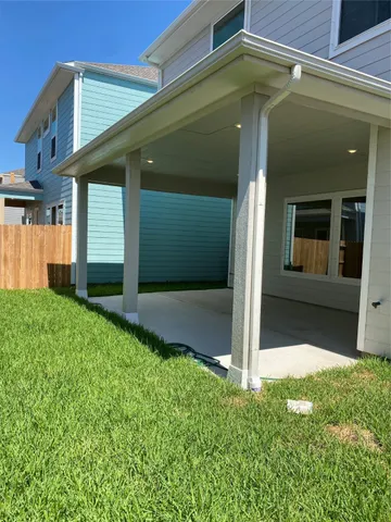 a view of a house with a small yard