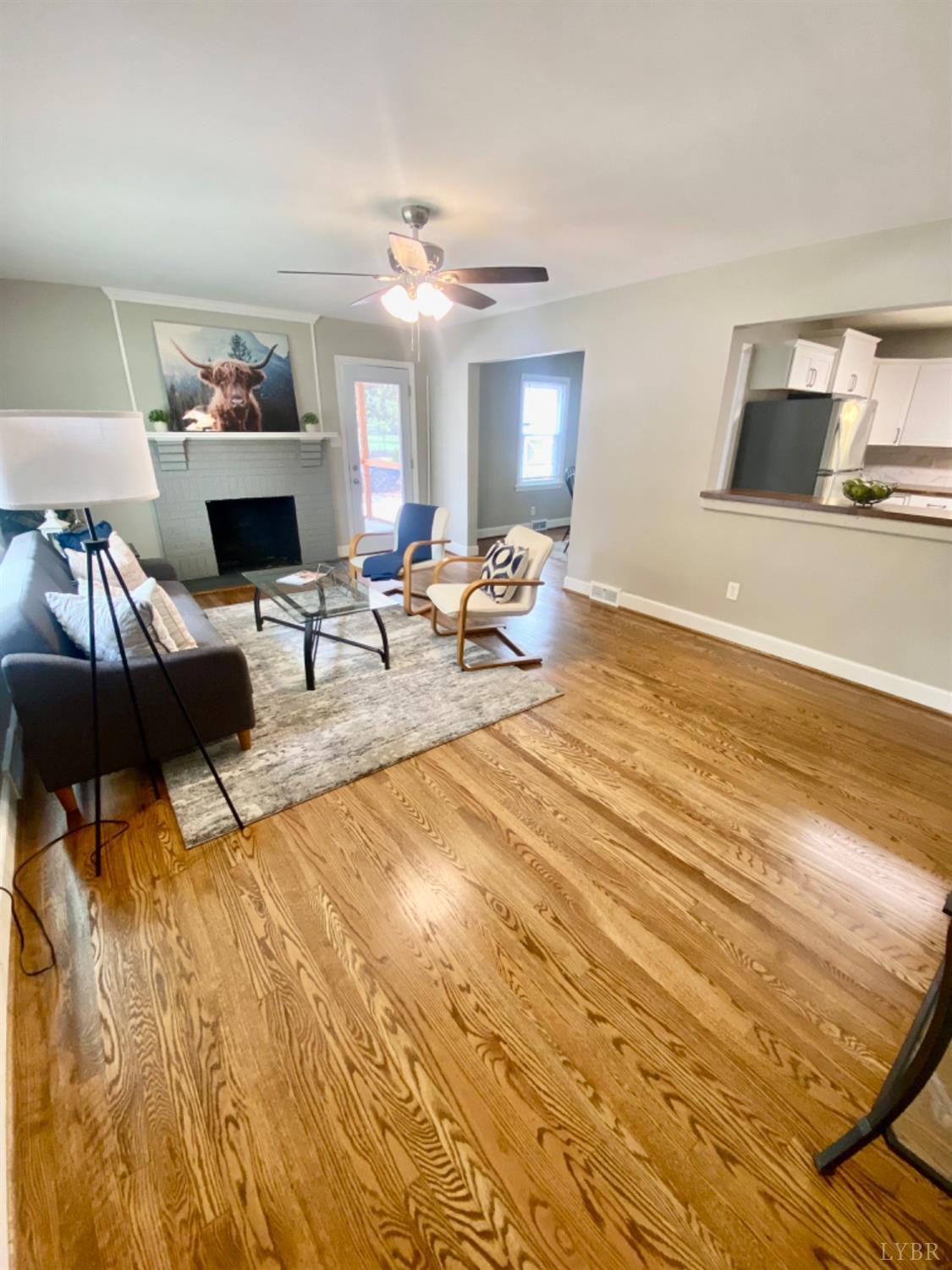 2412 Old Forest Road Lynchburg, VA 24501 - Photo 11 of 29 a living room with furniture and a wooden floor