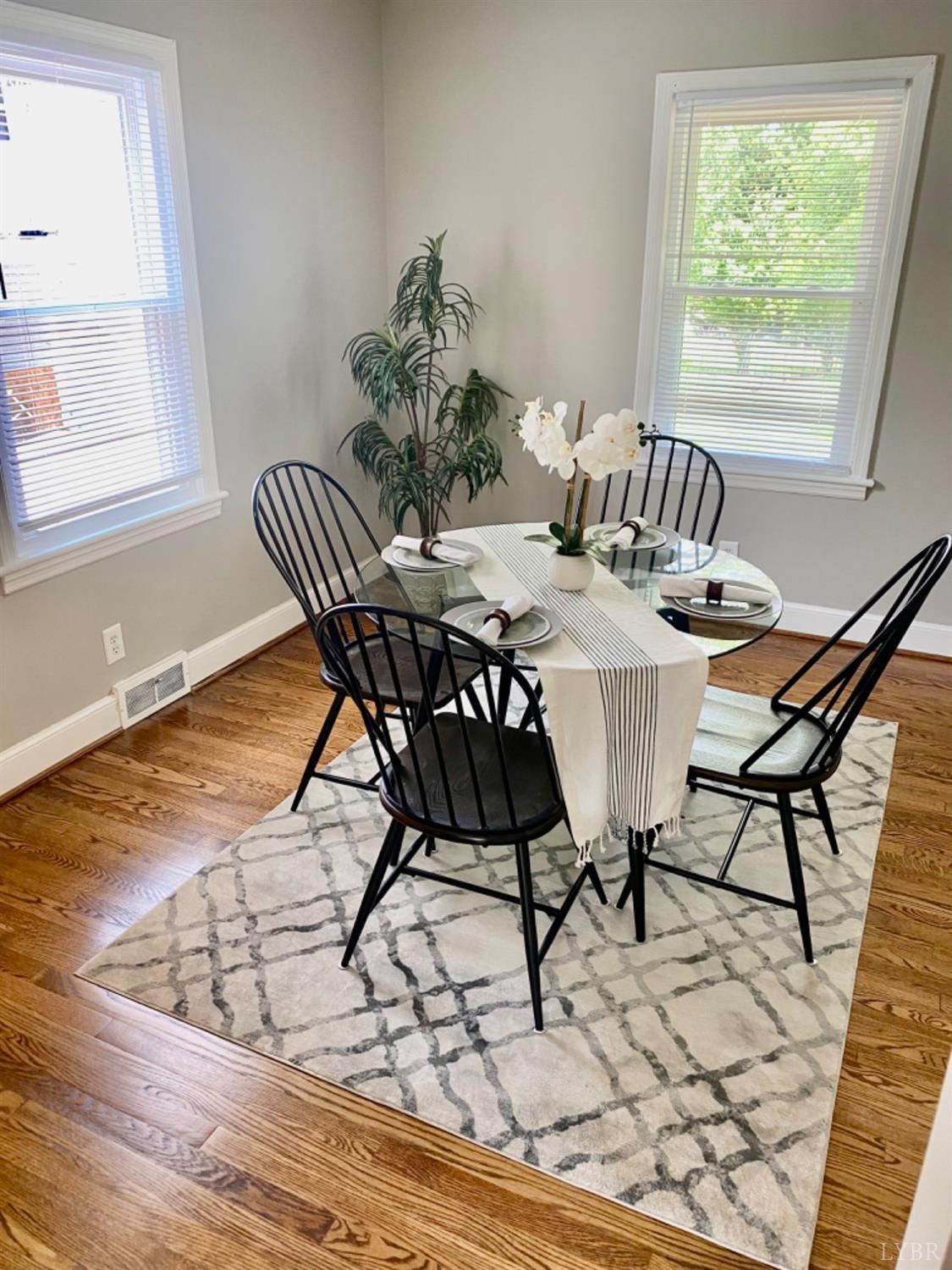 2412 Old Forest Road Lynchburg, VA 24501 - Photo 13 of 29 a view of a dining room with furniture and wooden floor
