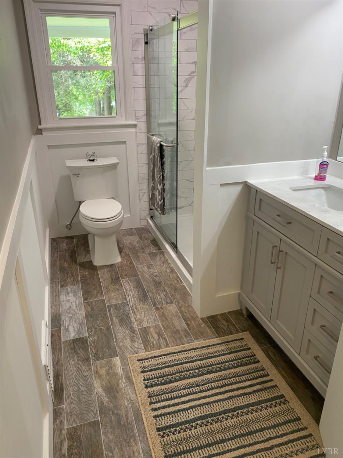 2412 Old Forest Road Lynchburg, VA 24501 - Photo 17 of 29 a bathroom with a sink toilet and shower