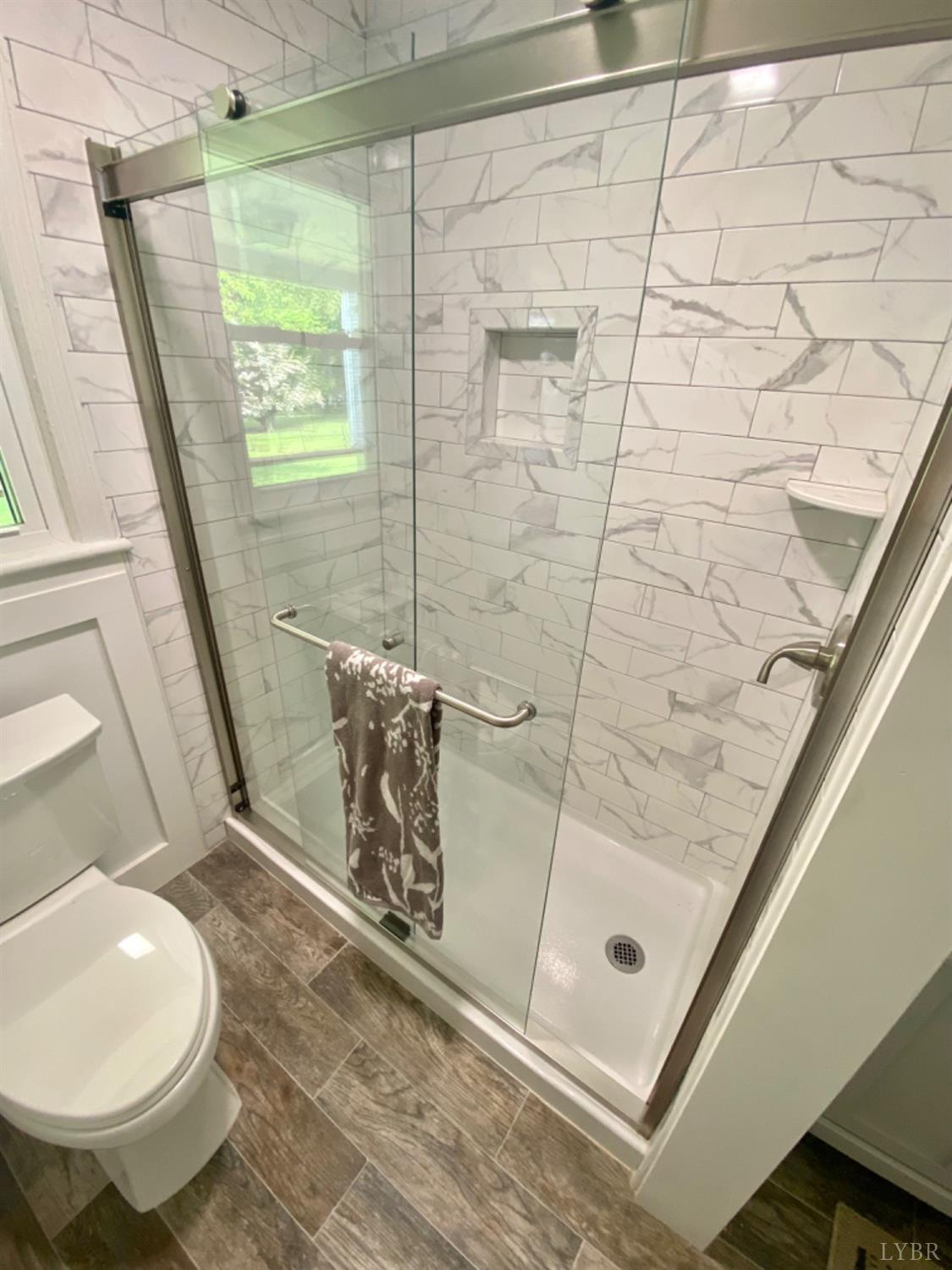 2412 Old Forest Road Lynchburg, VA 24501 - Photo 18 of 29 a bathroom with a toilet and a shower