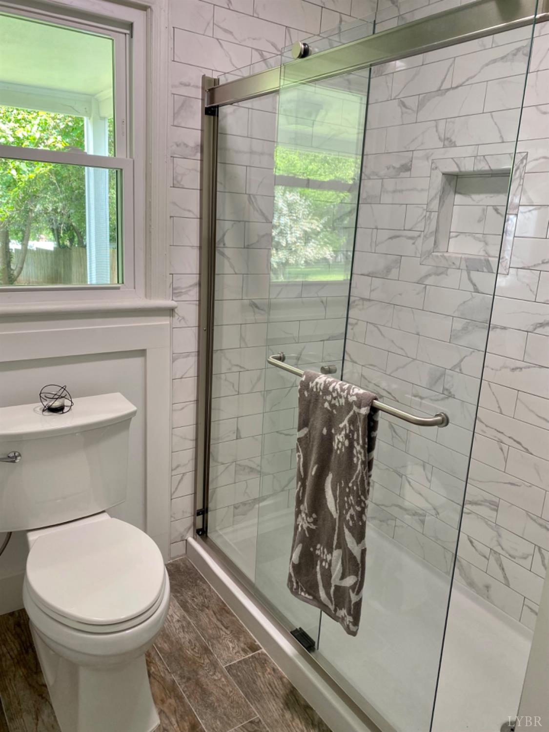 2412 Old Forest Road Lynchburg, VA 24501 - Photo 19 of 29 a bathroom with a toilet and a shower