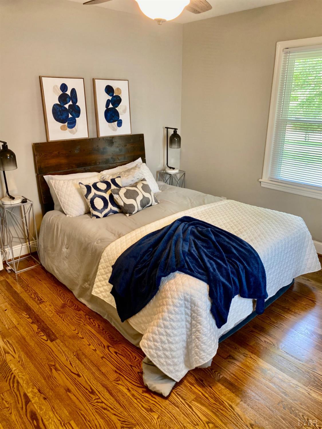 2412 Old Forest Road Lynchburg, VA 24501 - Photo 20 of 29 a bedroom with a bed and wooden floor
