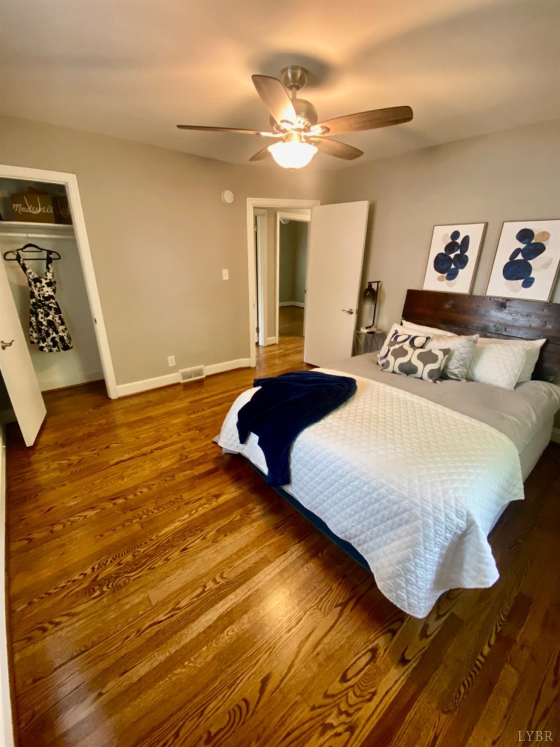 2412 Old Forest Road Lynchburg, VA 24501 - Photo 21 of 29 a bedroom with a bed and a night stand
