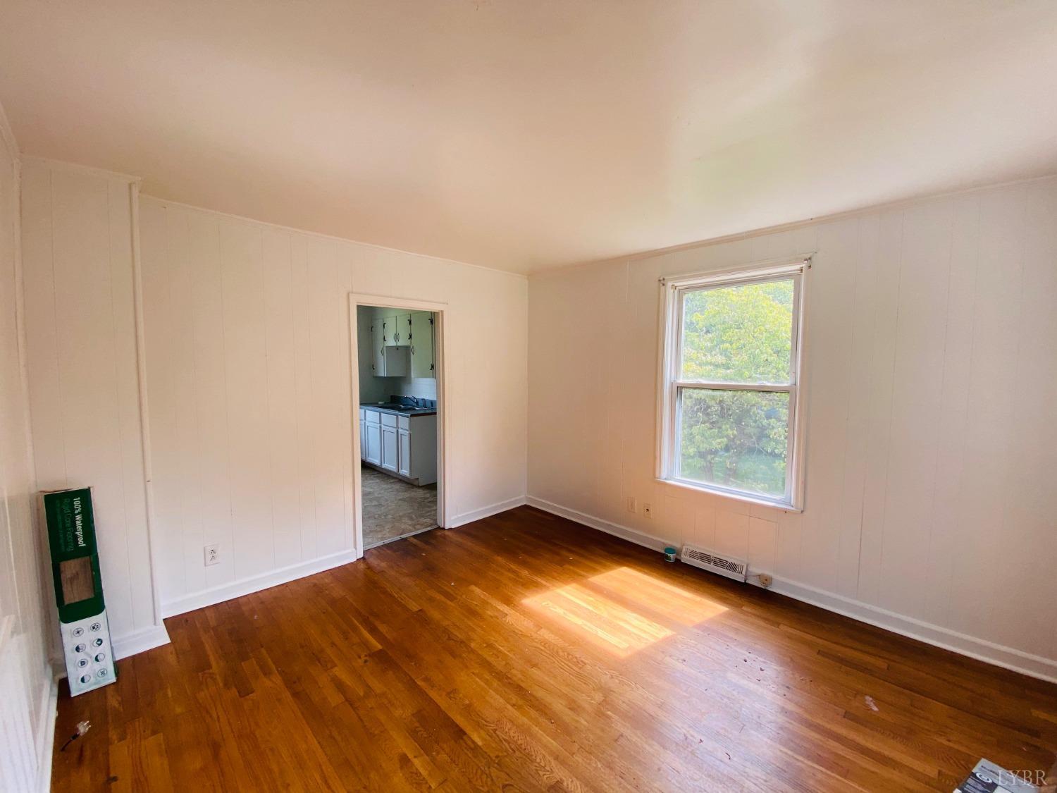 2412 Old Forest Road Lynchburg, VA 24501 - Photo 26 of 29 an empty room with wooden floor and windows