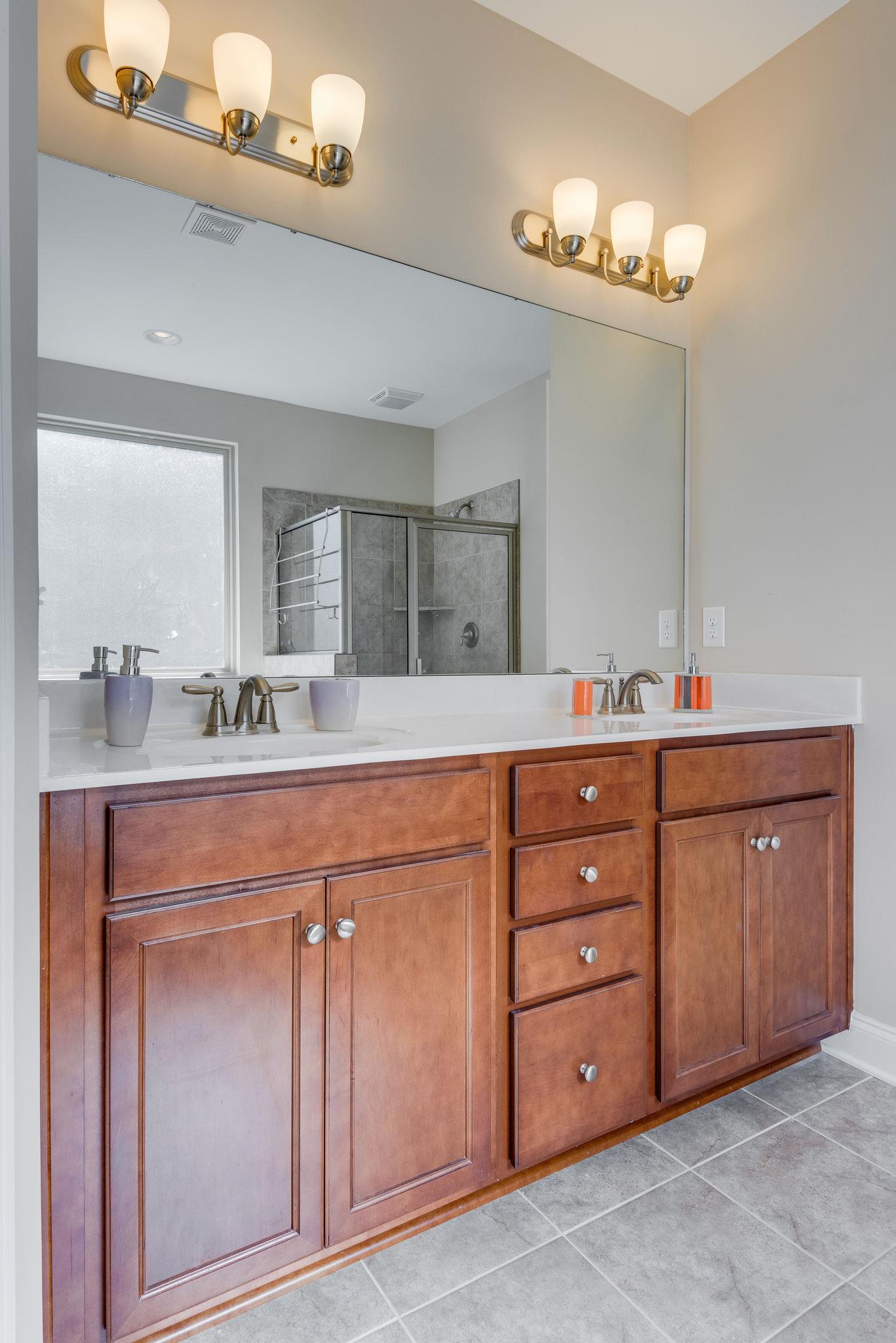 360 Old Stone Road Goodlettsville, TN 37072 - Photo 19 of 28 a spacious bathroom with double sink and a mirror