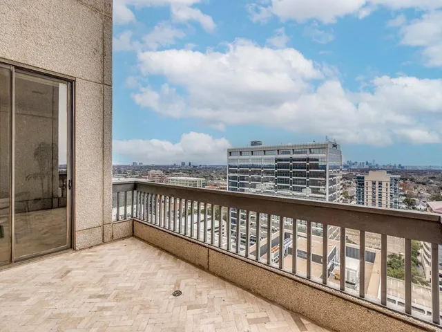 a view of a balcony with city view