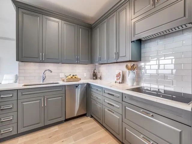 a kitchen with sink cabinets and window