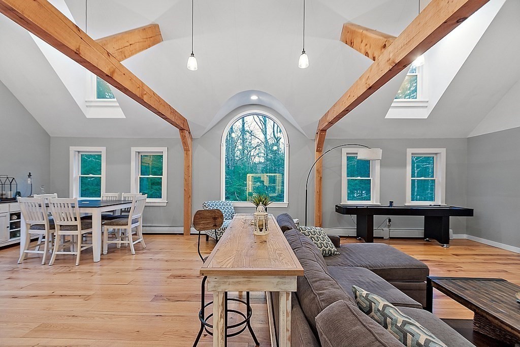 41 Maple Street Pepperell, MA 01463 - Photo 14 of 39 a view of a dining room with furniture window and wooden floor