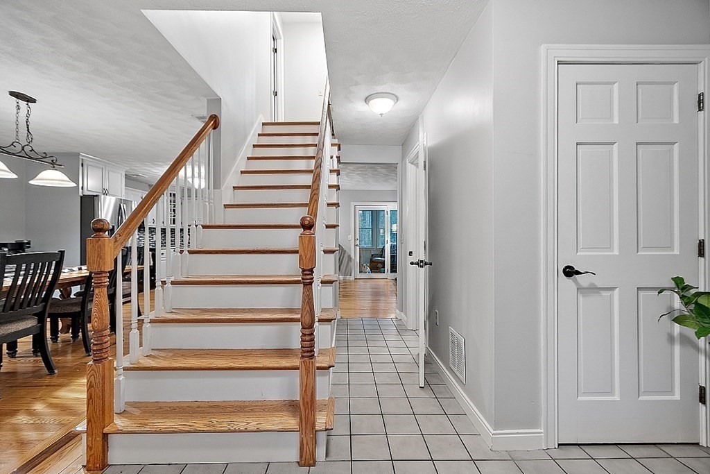 41 Maple Street Pepperell, MA 01463 - Photo 18 of 39 a view of entryway and hall with wooden floor