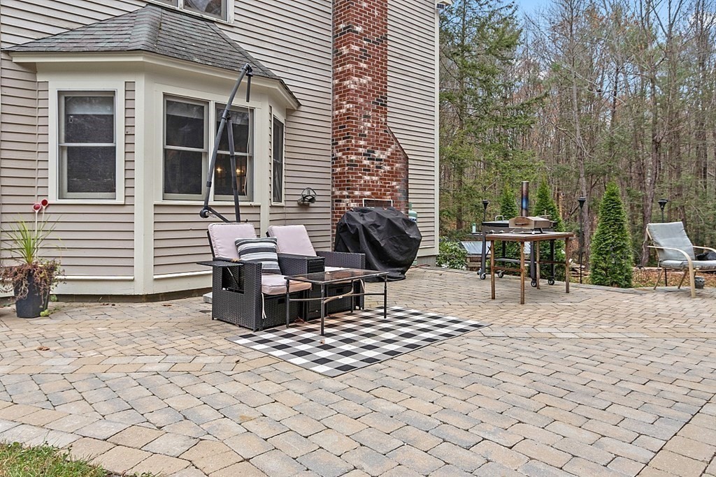 41 Maple Street Pepperell, MA 01463 - Photo 34 of 39 a view of a tables and chairs in a patio