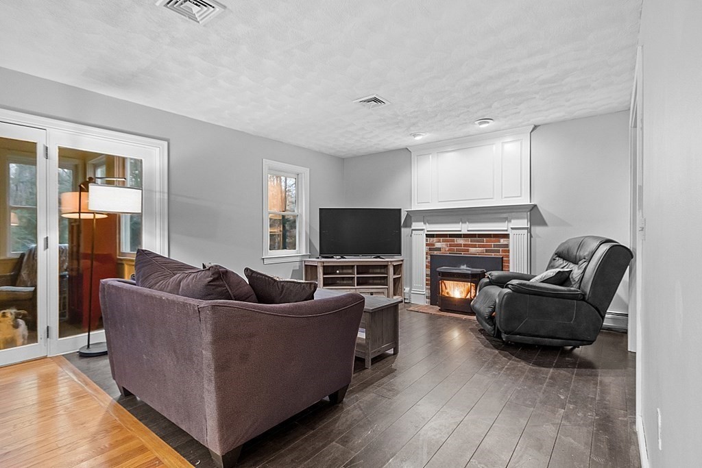 41 Maple Street Pepperell, MA 01463 - Photo 6 of 39 a living room with furniture and a flat screen tv