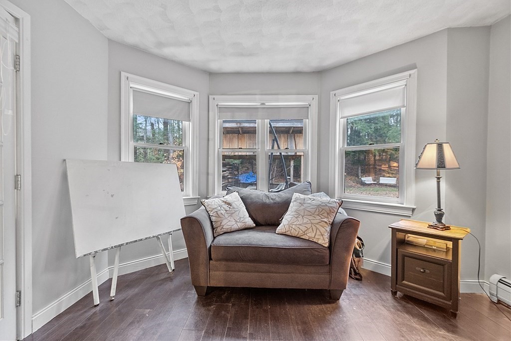 41 Maple Street Pepperell, MA 01463 - Photo 9 of 39 a living room with furniture and a window