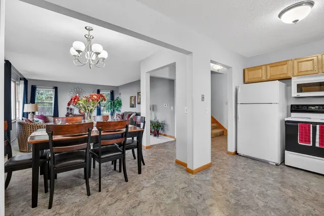 a kitchen with stainless steel appliances granite countertop a refrigerator sink and cabinets