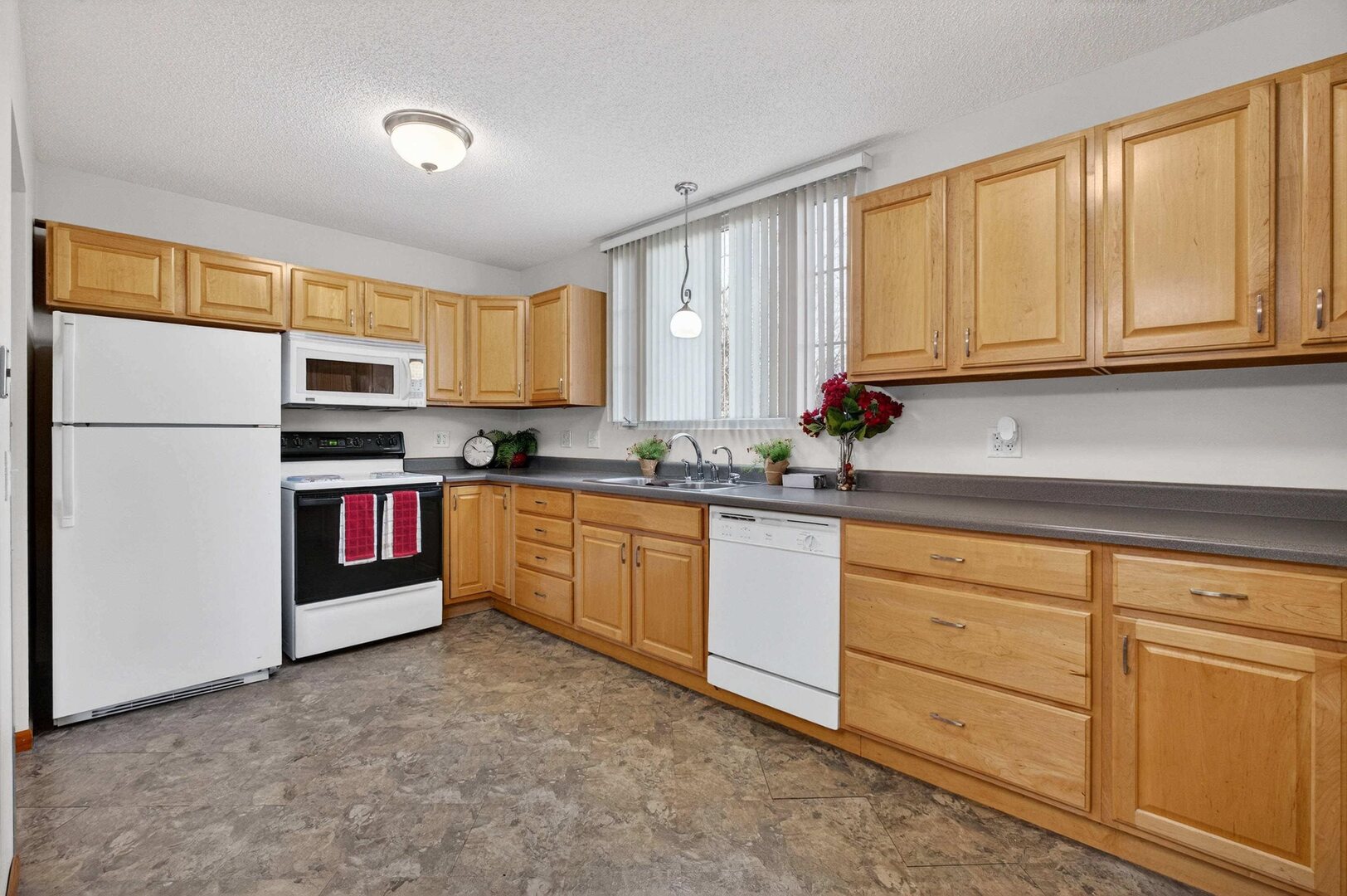 4318 5th Street East Moline, IL 61244 - Photo 14 of 30 a kitchen with stainless steel appliances granite countertop a refrigerator sink and cabinets