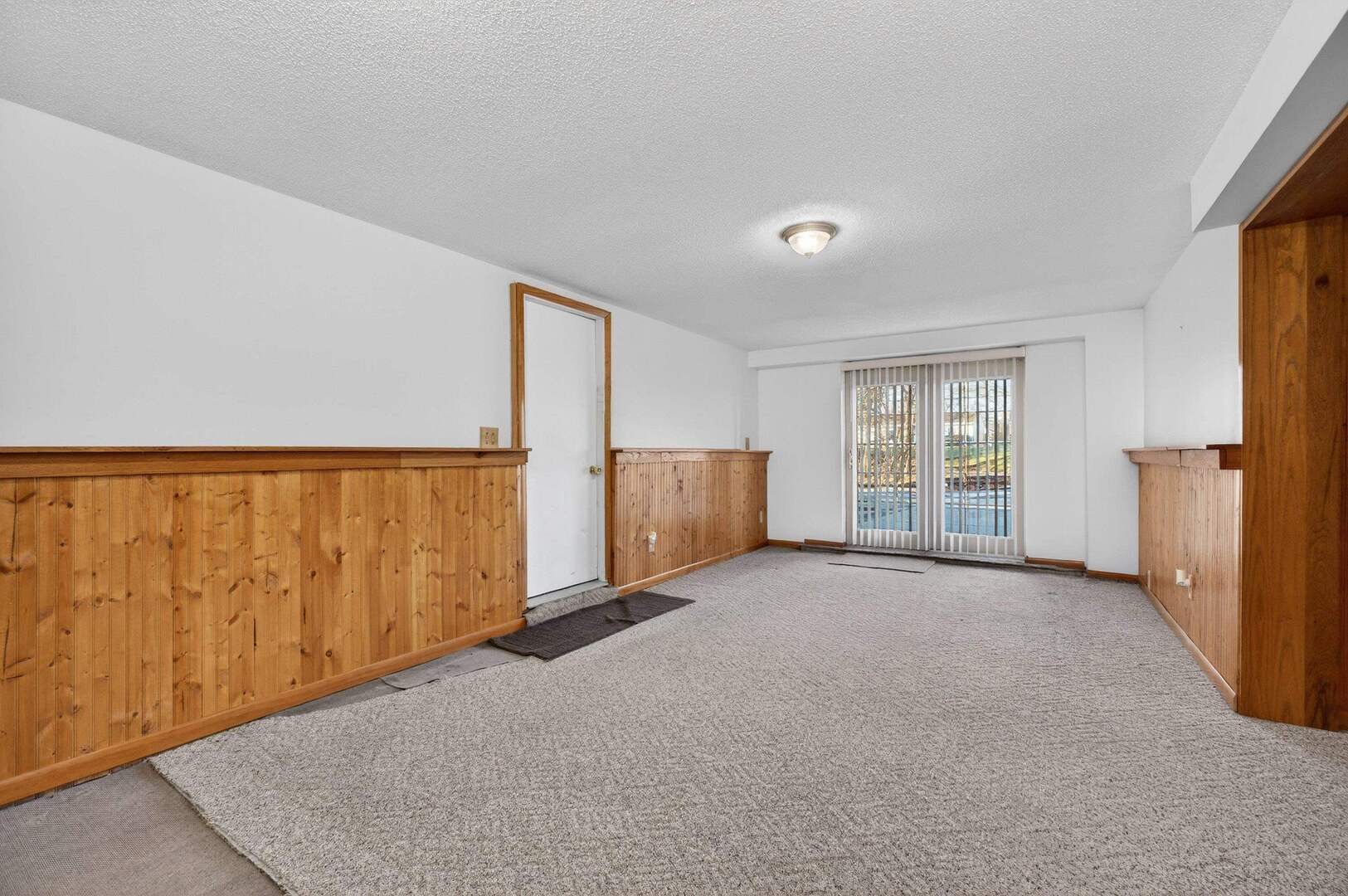 4318 5th Street East Moline, IL 61244 - Photo 25 of 30 an empty room with a window and a kitchen