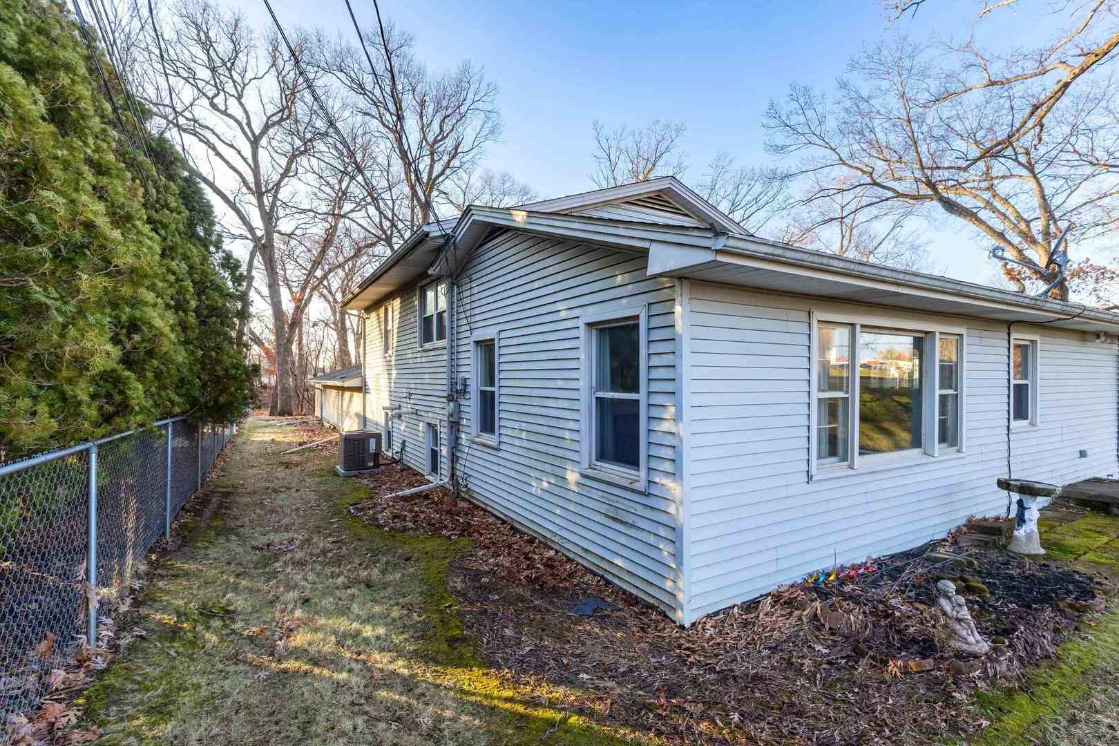 4318 5th Street East Moline, IL 61244 - Photo 29 of 30 a view of a house with a yard and furniture