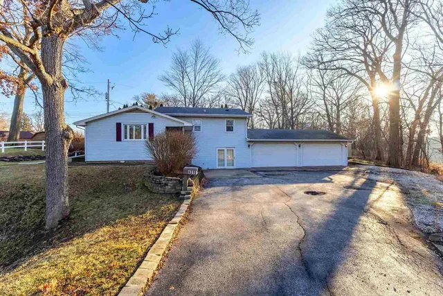 a view of a house with a yard covered with snow in the yard