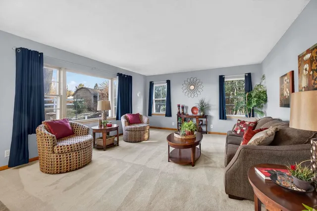 a living room with furniture and a lamp