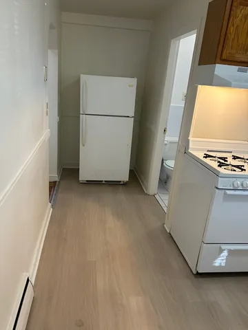 a view of kitchen and utility room with windows
