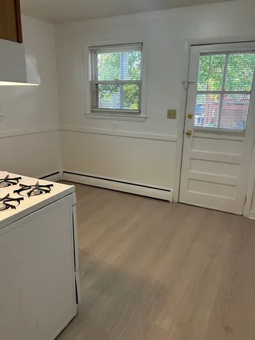 a view of a livingroom with an empty space and window