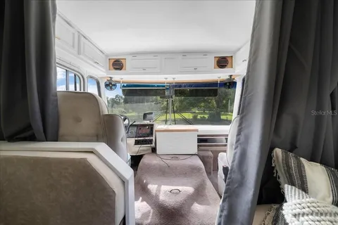 a view of livingroom with furniture and a window