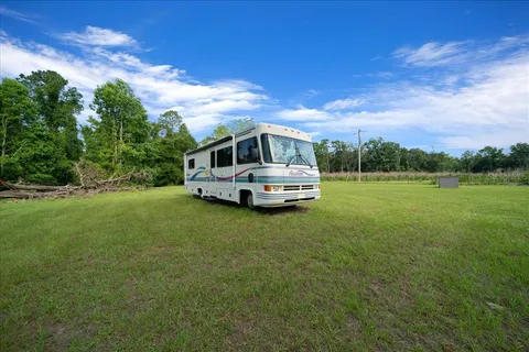 a car parked in the middle of a field