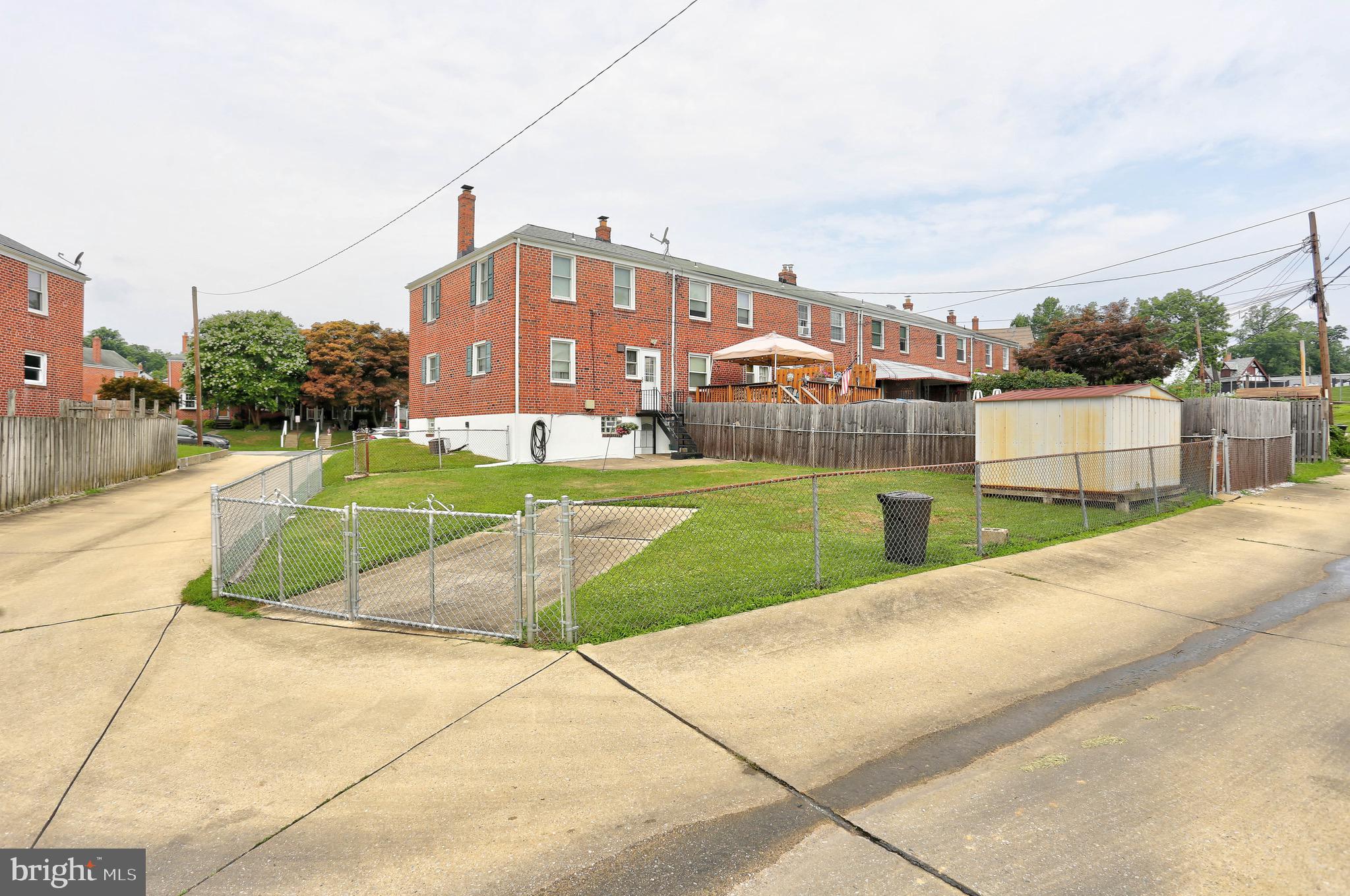 123 Garden Ridge Road Baltimore, MD 21228 - Photo 21 of 29 a view of a community park with multi story residential apartment building in the back