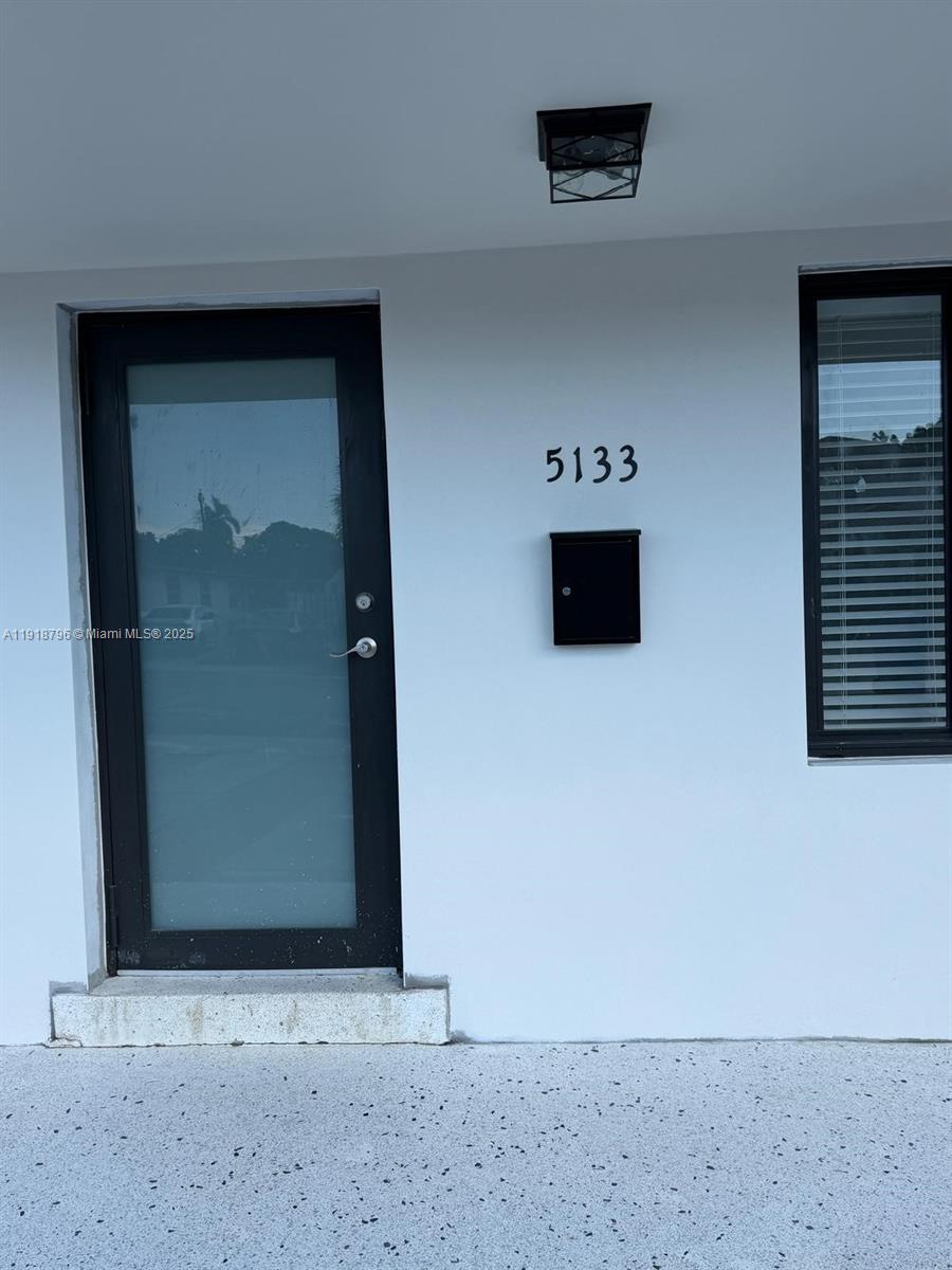5133 Northwest 4th Street, Unit 1 Miami, FL 33126 - Photo 11 of 11 a view of a hallway with wooden floor