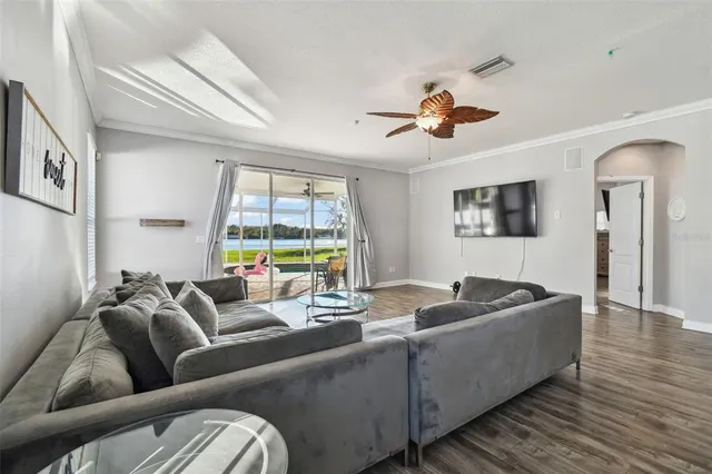a kitchen with granite countertop a sink cabinets and stainless steel appliances