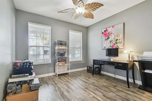 a view of a swimming pool with a patio and fire pit