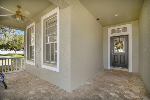 a view of a room with wooden floor and furniture