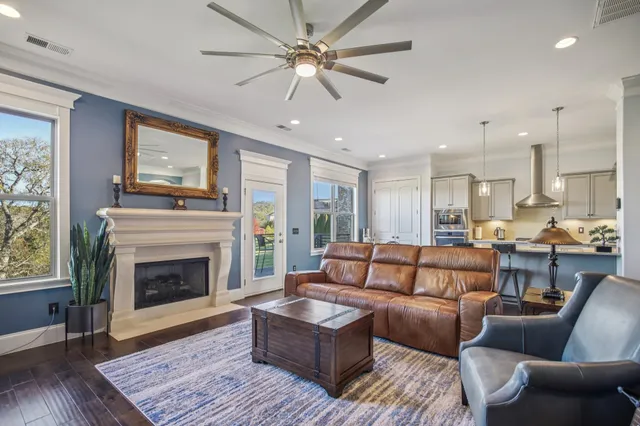 a living room with furniture and a fireplace