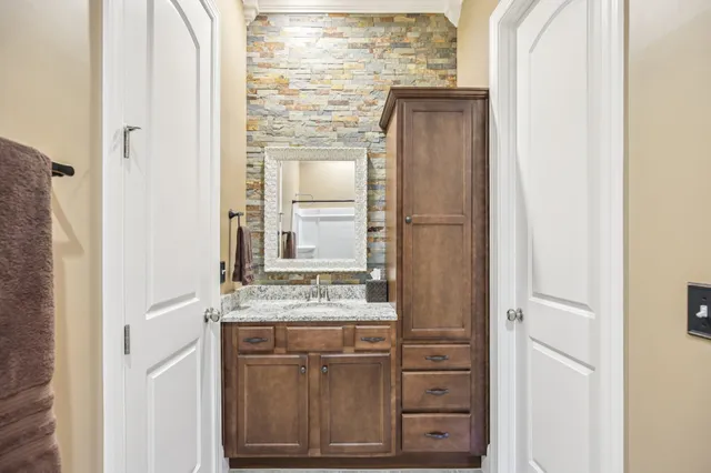 a bathroom with a tub and a sink