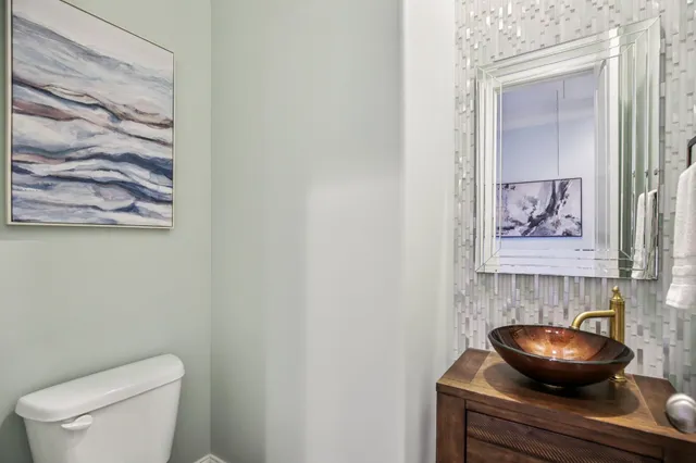 a room with furniture pool table and window