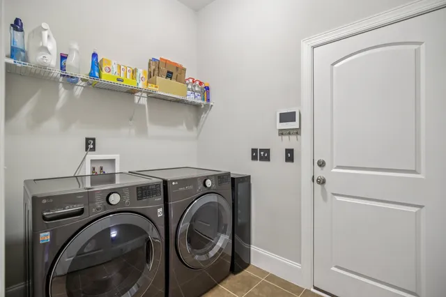 a living room with furniture and a rug