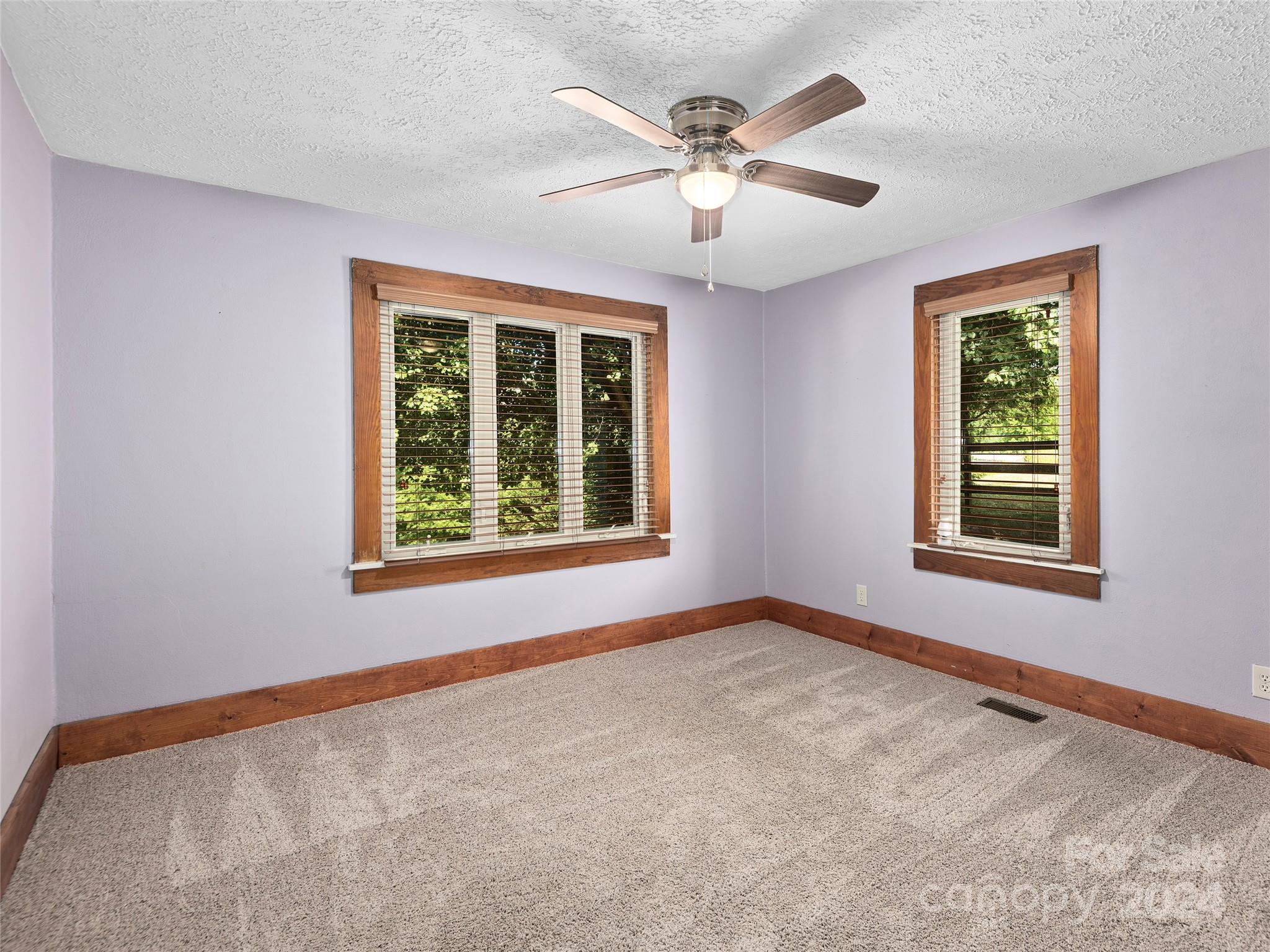 2356 Panther Creek Road Clyde, NC 28721 - Photo 18 of 22 a view of an empty room with a window