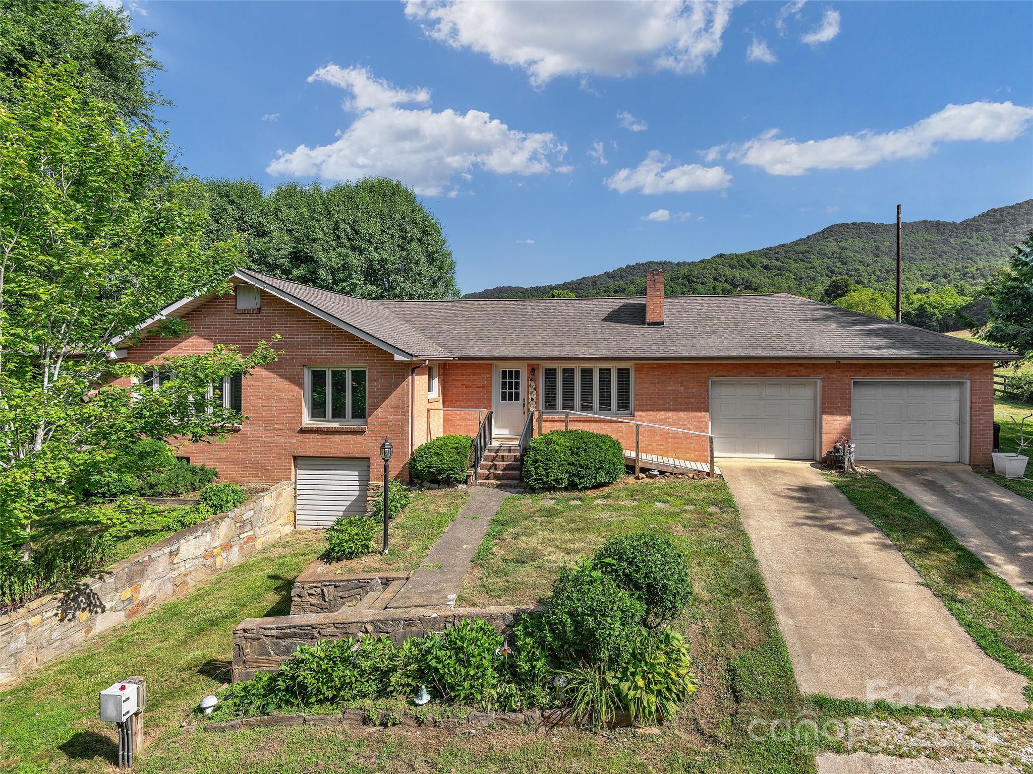 2356 Panther Creek Road Clyde, NC 28721 - Photo 2 of 22 front view of a house with a yard
