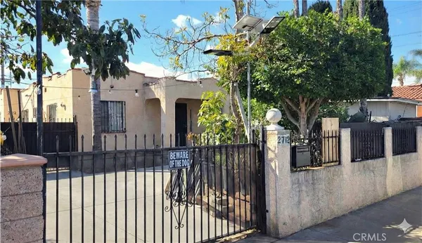 a view of a house with a tree