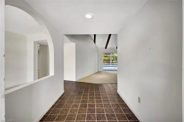a view of an empty room with a sliding door