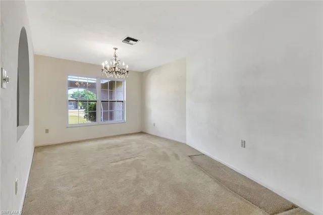 a bed sitting in a room next to a window