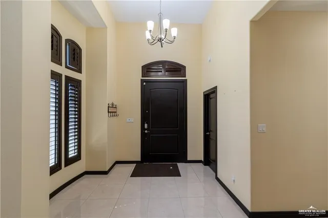 a view of a hallway with a chandelier