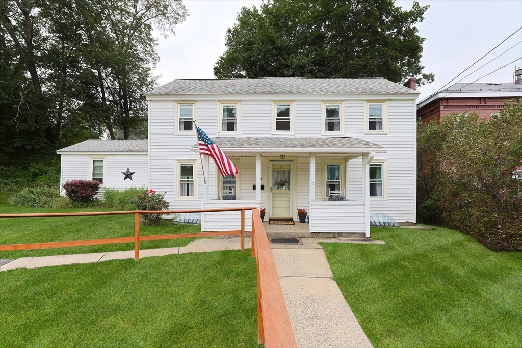 13 Wilson Street Clinton, MA 01510 - Photo 1 of 23 a front view of a house with a yard