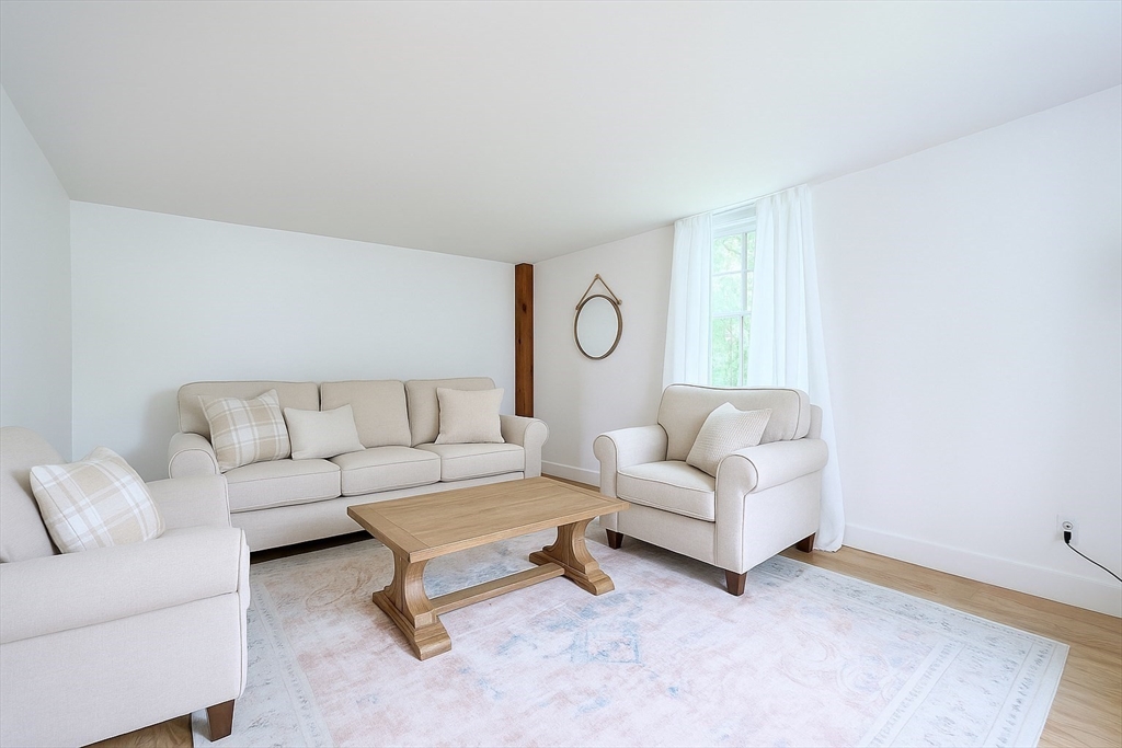 13 Wilson Street Clinton, MA 01510 - Photo 12 of 23 a living room with furniture and a rug
