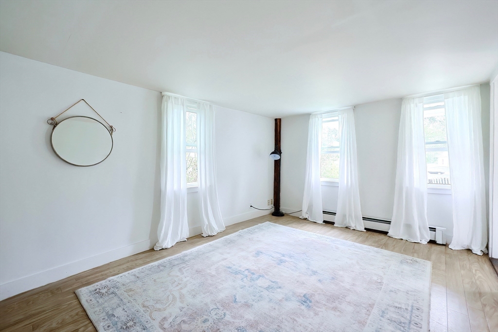 13 Wilson Street Clinton, MA 01510 - Photo 14 of 23 an empty room with windows and closet