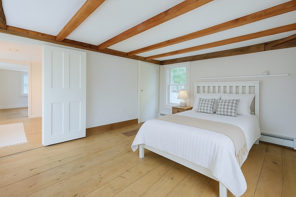 13 Wilson Street Clinton, MA 01510 - Photo 16 of 23 a bedroom with a bed and a window