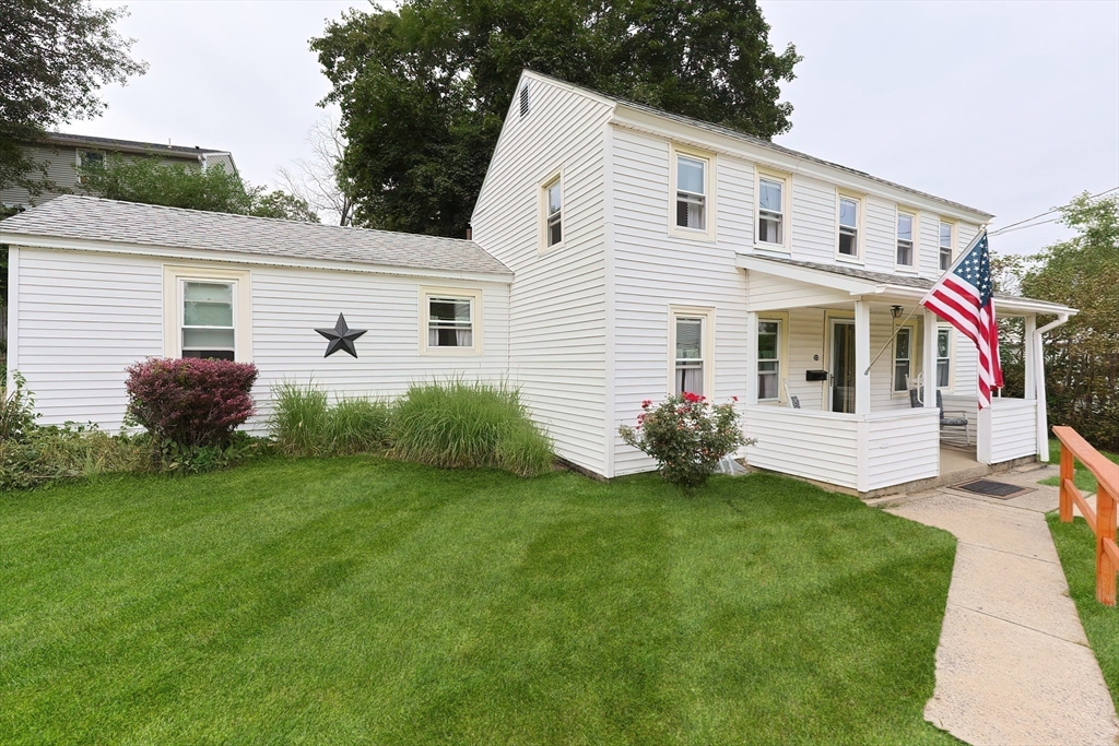13 Wilson Street Clinton, MA 01510 - Photo 3 of 23 a front view of a house with a garden