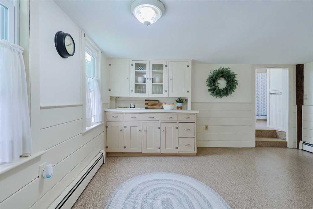 13 Wilson Street Clinton, MA 01510 - Photo 7 of 23 a room with a dresser and a window